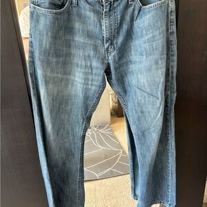 Torn and Repaired Levi Strauss Blue Denim Jeans